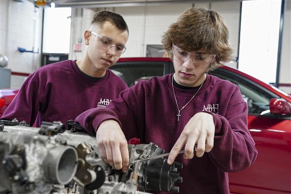 Automotive Technology student working on cars